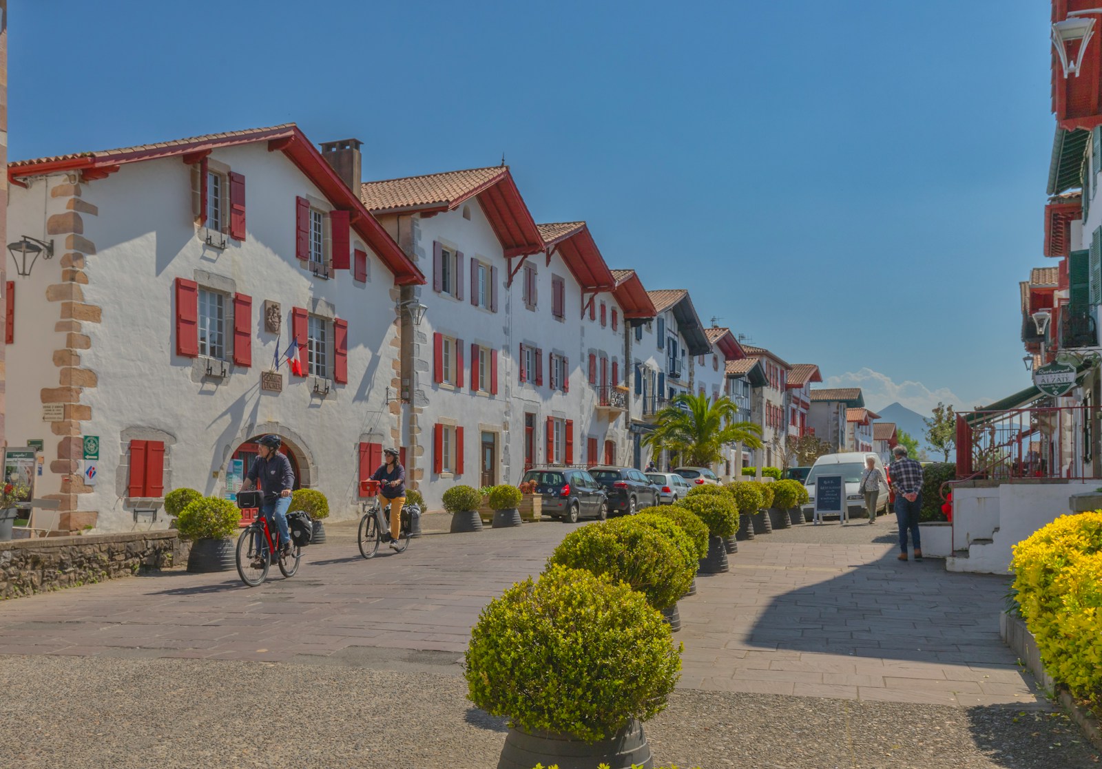 Colorful buildings line a quaint european street.
