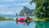 Asian Thai women in badsuit on the edge of an infinity pool at Koh Phi Phi Thailand